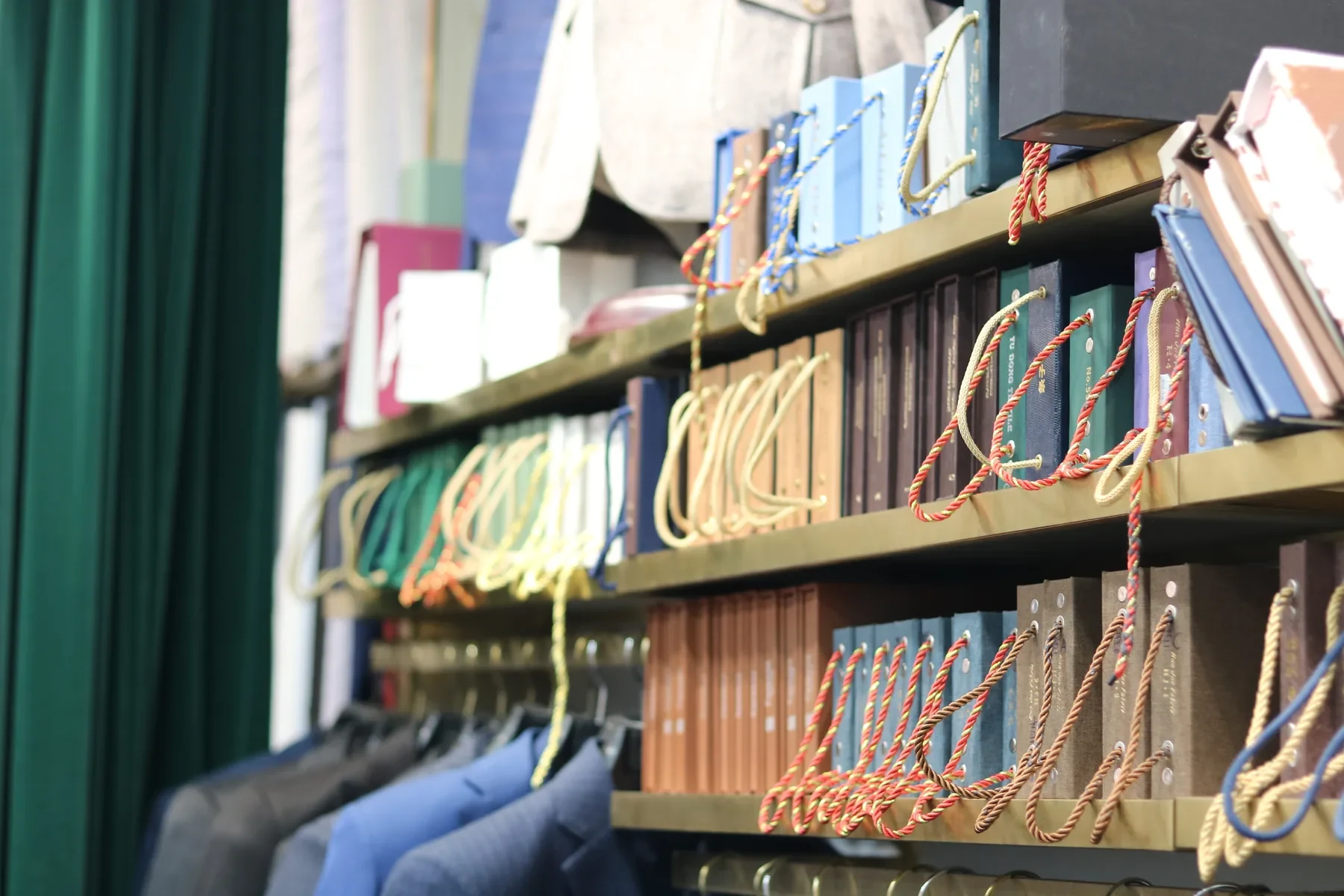 Rows of fabric sample books on the shelves inside Wuyue’s tailoring shop